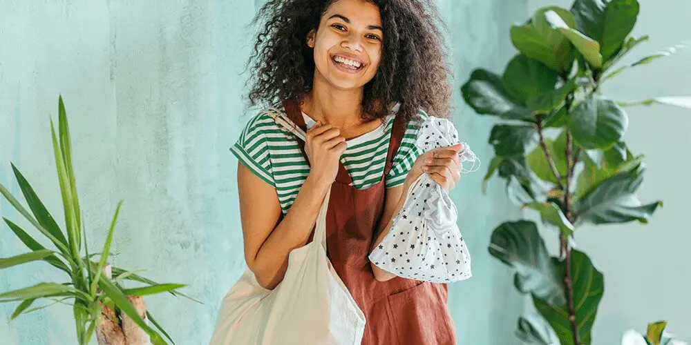 person holding reusable products