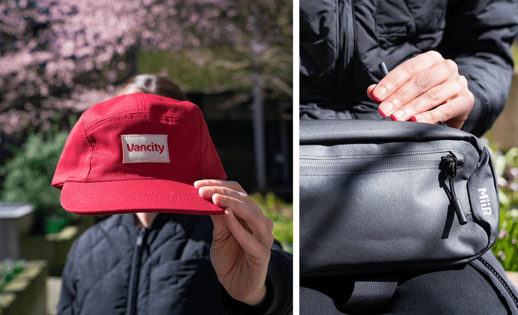 2 Images: First is a person standing outside, holding up a red Vancity baseball cap, covering their face. Second is a woman from behind standing below a cherry blossom tree, carrying a small, MiiR crossbody black backpack.