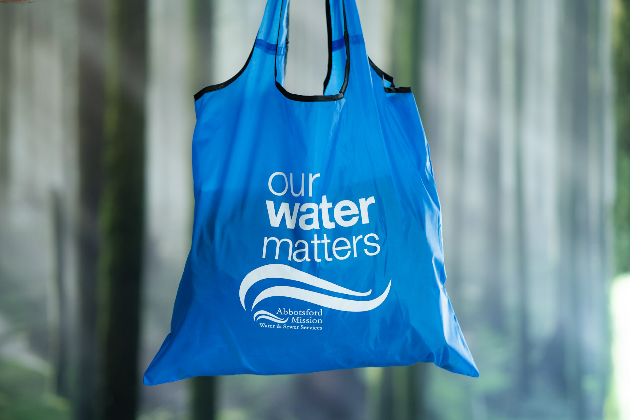 blue reusable tote bag with the words our water matters Abbotsford Mission water and sewer services.