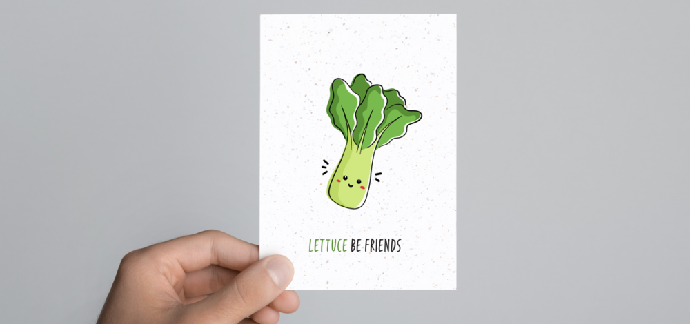 See paper post card with an image of a cartoon lettuce and the words: Lettuce be friends.