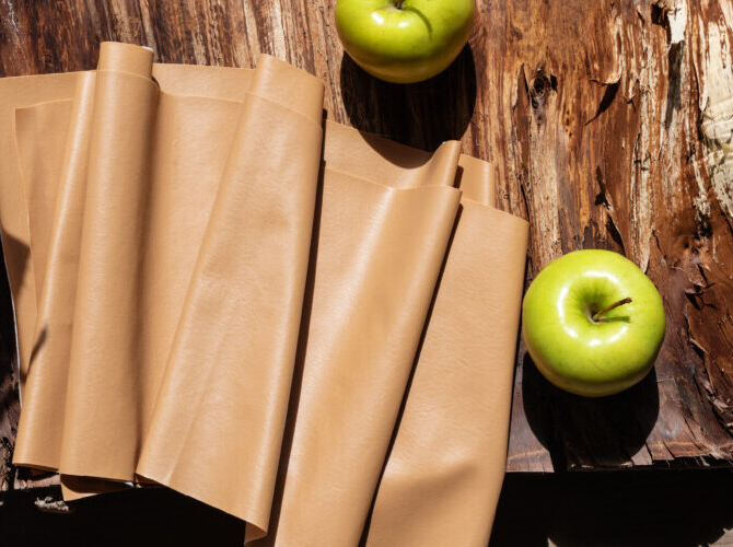 Vegan leather surrounded by apples