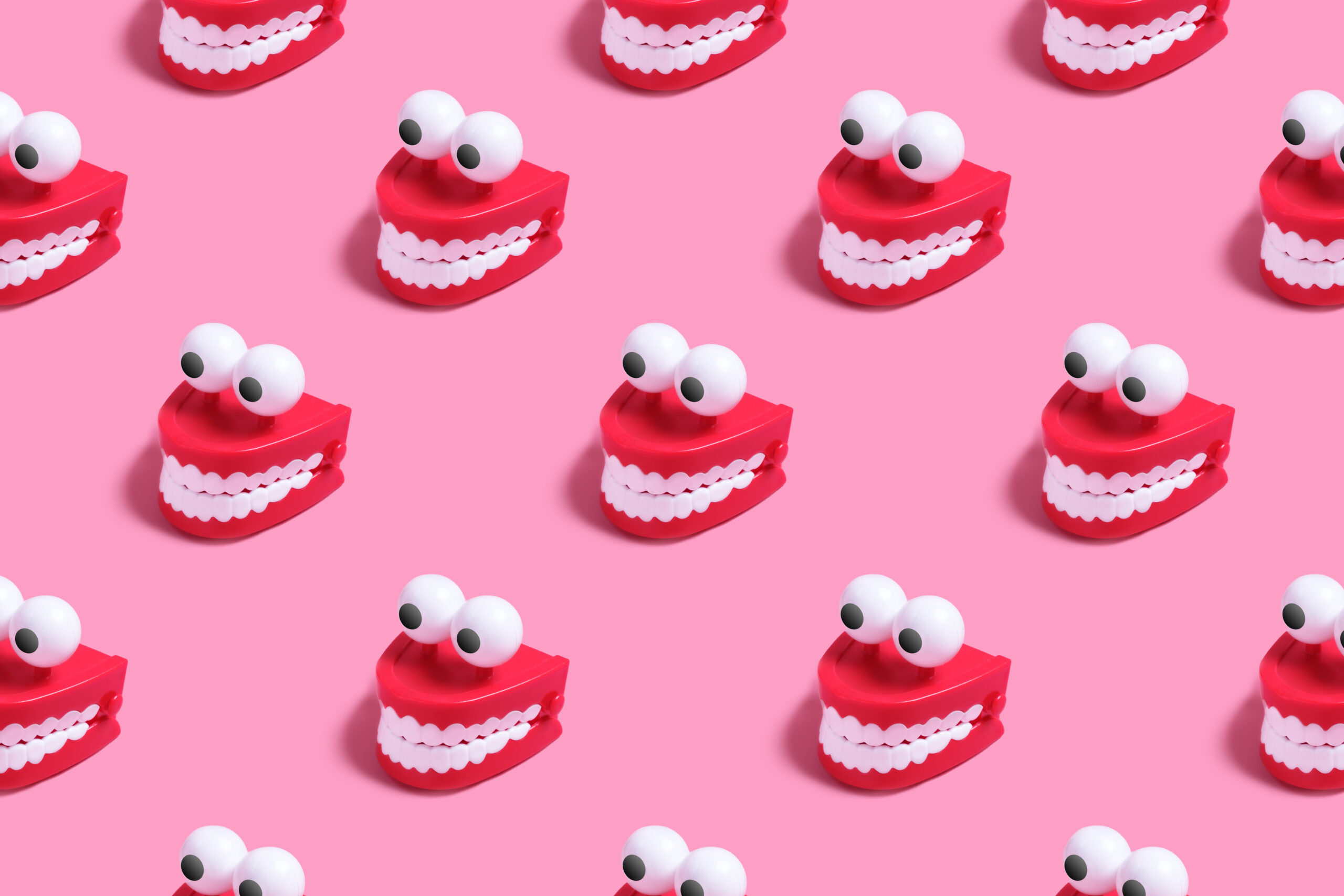 Pattern plastic toy in the form of red jaws with white teeth and eyes
