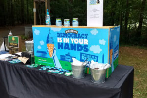 Table with democracy is in your hands branded items