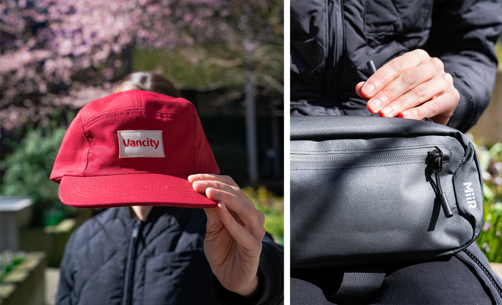 2 Images: First is a person standing outside, holding up a red Vancity baseball cap, covering their face. Second is a woman from behind standing below a cherry blossom tree, carrying a small, MiiR crossbody black backpack. 