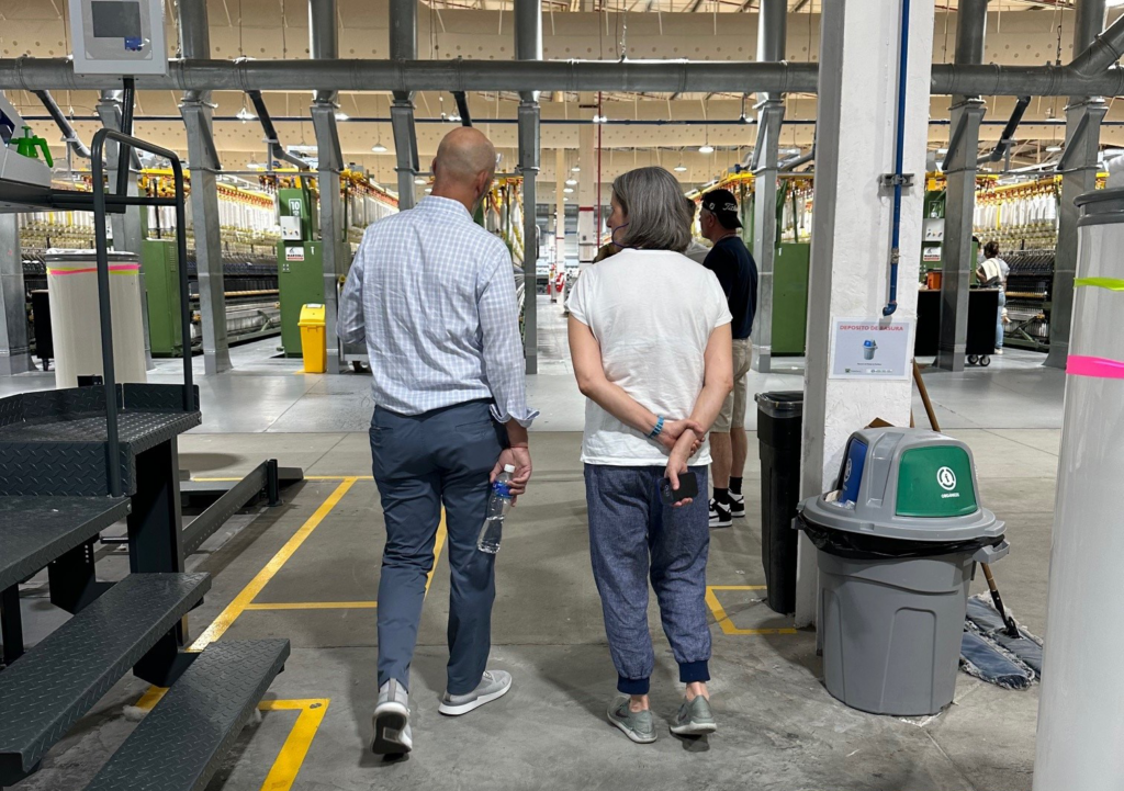 Picture of Denise and Renato during the  factory tour.