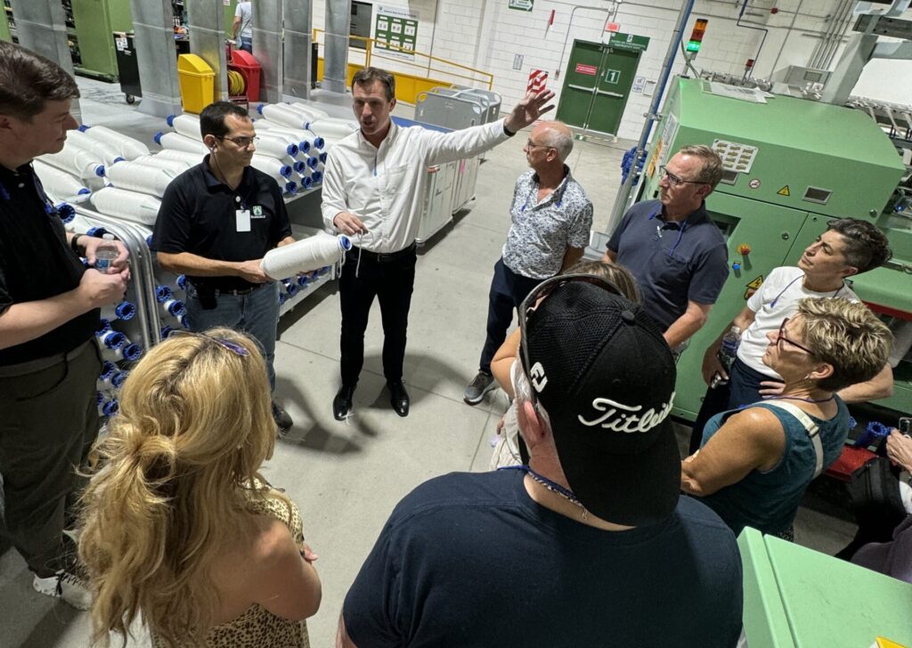 people standing on a warehouse floor