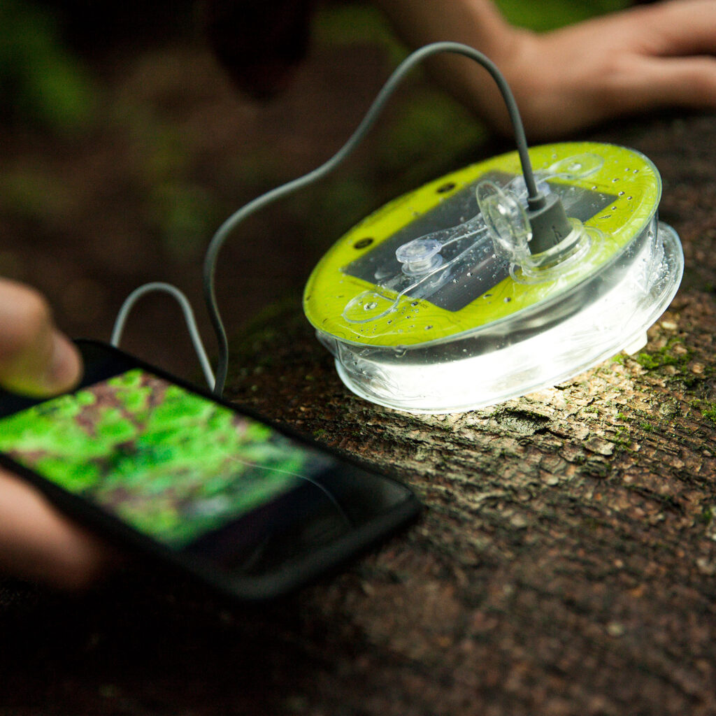 close up of a solar light charging a cell phone