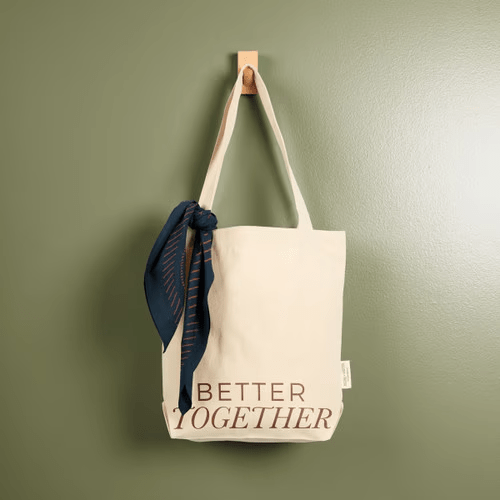 Numo Work + Shelter Bandana tied to a tote bag