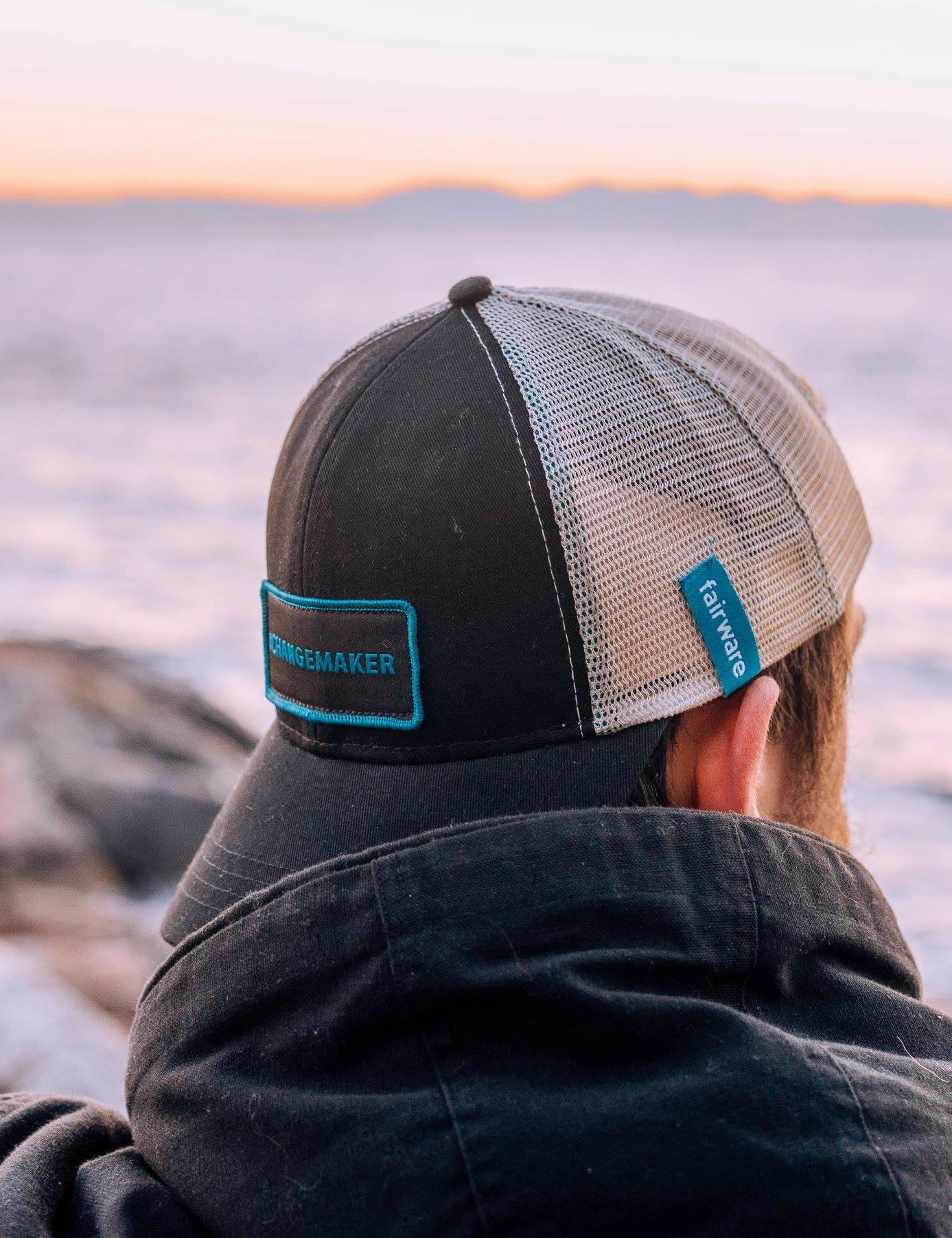 person wearing fairware branded hat