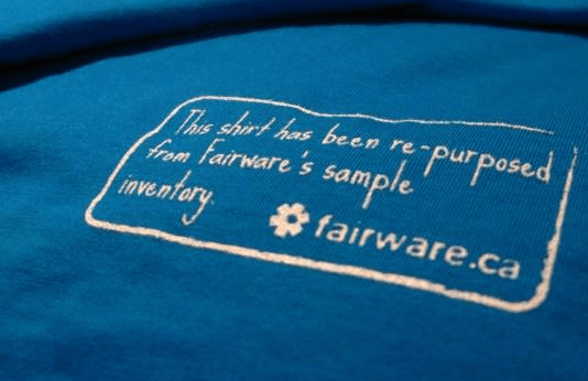screen printing of old fairware logo on a blue shirt