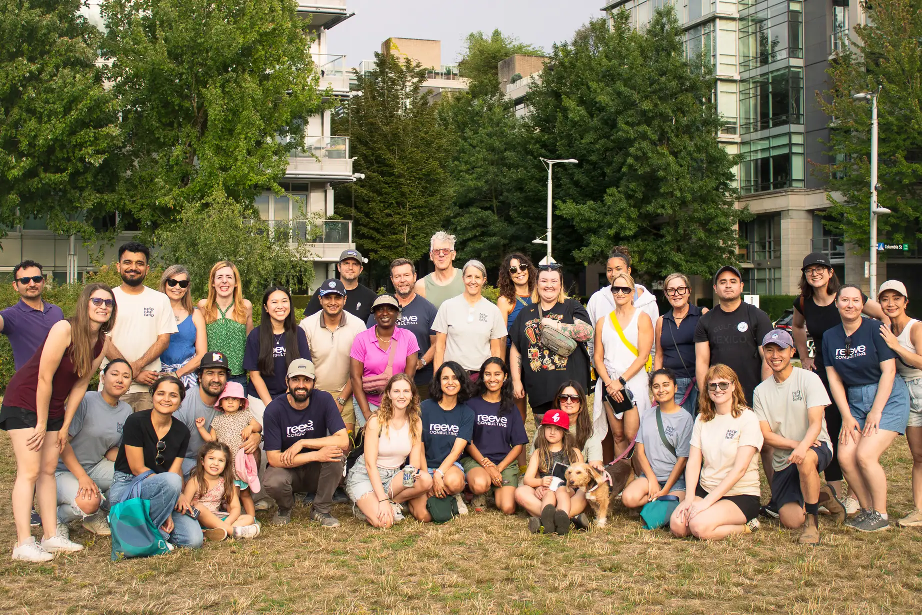 People gather from Fariware and Reeve consulting with community to pick up trash around hinge park and stop for a group photo